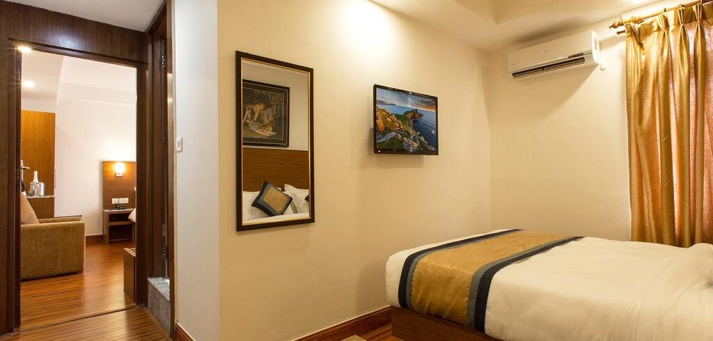 saket hall consisting of multiple decorated  chairs - The Kailash Boutique Hotel Hotel